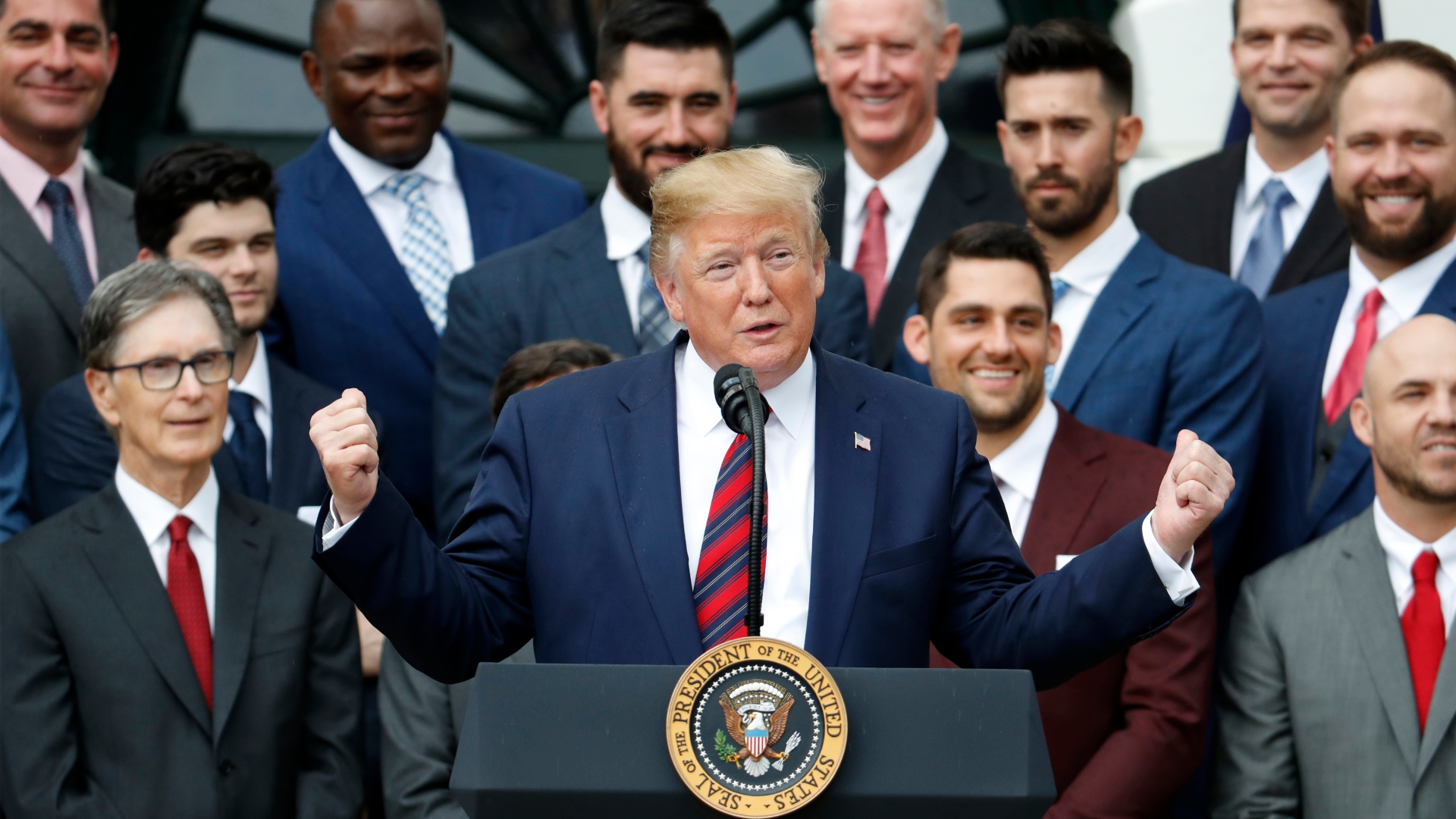 President Donald Trump receives a jersey with his name from Boston Red Sox J.D.  Martinez, Right Fielder, right, as he welcomes the 2018 World Series  Champions to the White House, The Boston